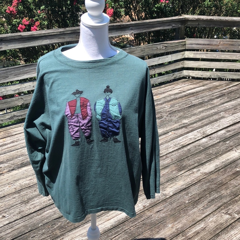 Cute green casual top with 2 figures on front